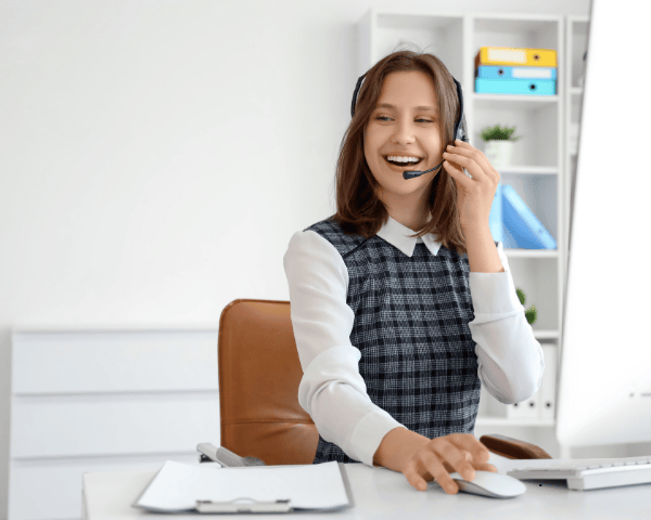 A happy local business owner talking on the phone.