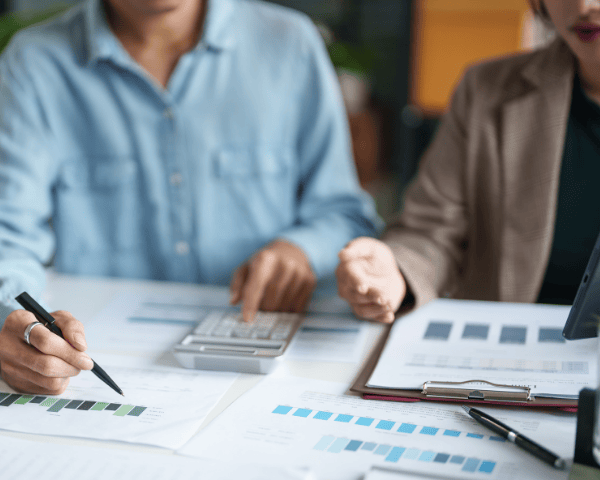 Two people doing paperwork.