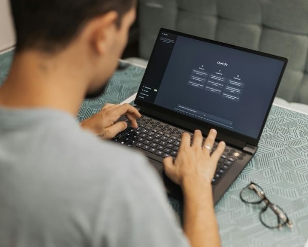 An entrepreneur working on marketing & Business on his laptop.