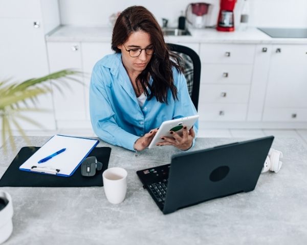 A digital marketer looking at analytics of the seo for dentists she services.