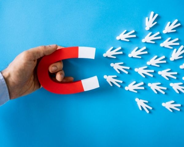 A magnet attracting leads.
