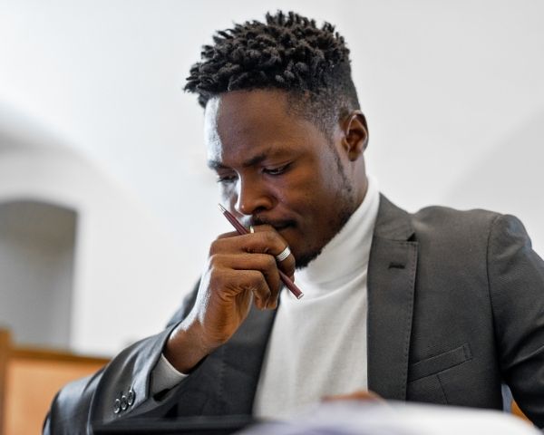 A thinking business owner contemplating seo optimization service.