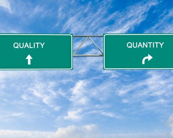 Road signs trying to get people to choose quality or quantity.