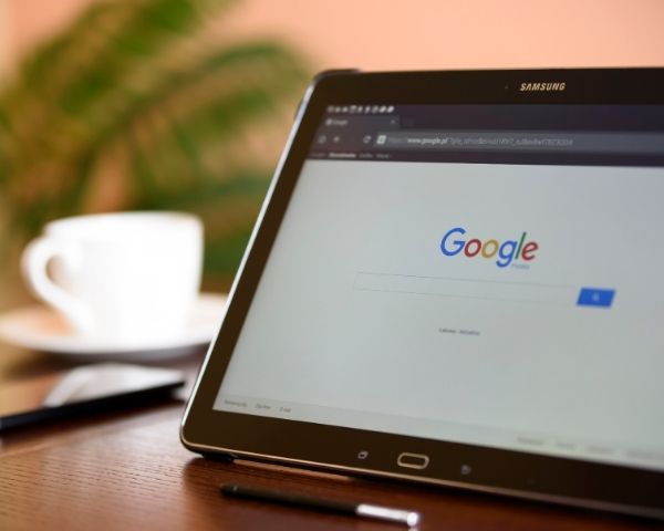 A laptop with the Google search bar ready to search.