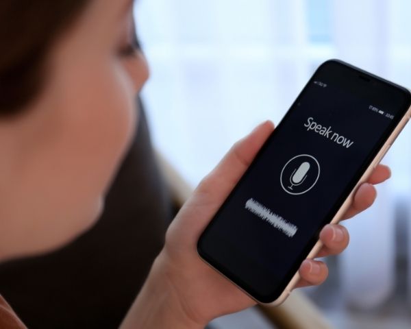 A lady using voice search to find an seo agency usa company.
