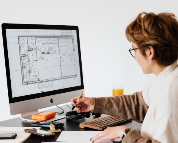 A person designing a layout in web design firms.