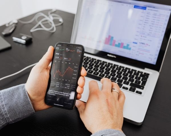 A person using their phone using marketing ai to help businesses.