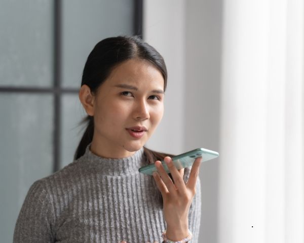 A lady talking on the phone.