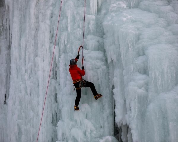 A man climbing a cliff.