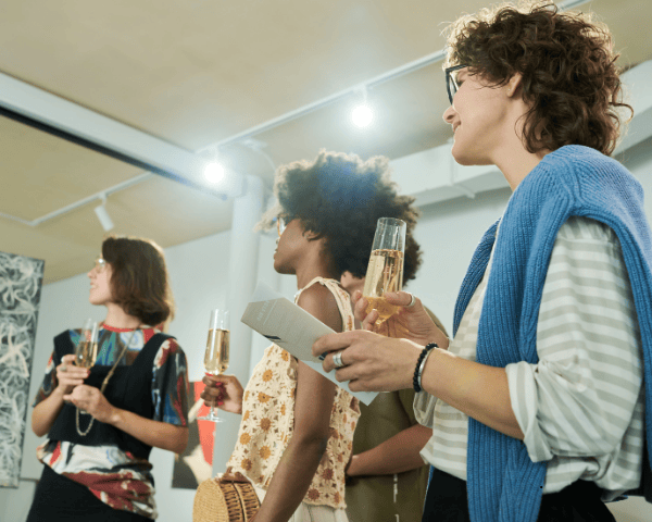 Three ladies from an online marketing agency drinking champagne