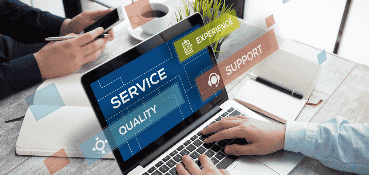 A team working on a laptop delivering marketing services.