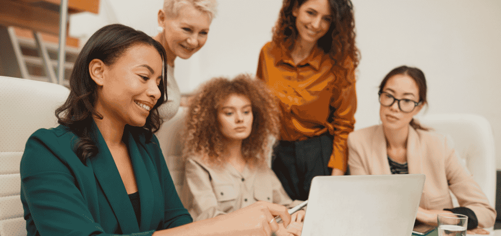 A group of people in the email marketing firms working together on a project.