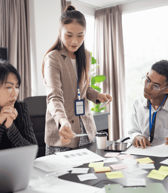 A team looking at paperwork in a digital marketing company.