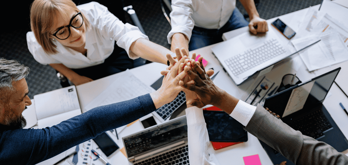 AI for Digital Marketing team giving each other a high-five.