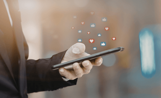 A man's phone exhibiting alot of notification due to a social media marketing agency and their work.