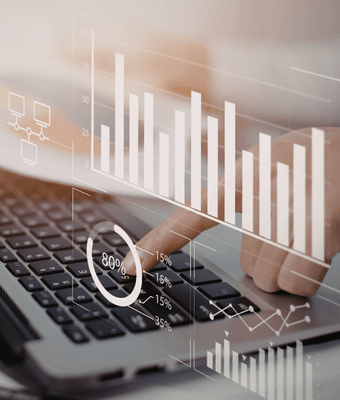 A Digital marketing firms tapping on their laptop.