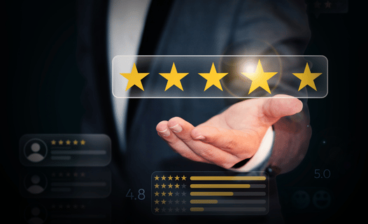 A hand holding star ratings indicating the importance of online reputation management.