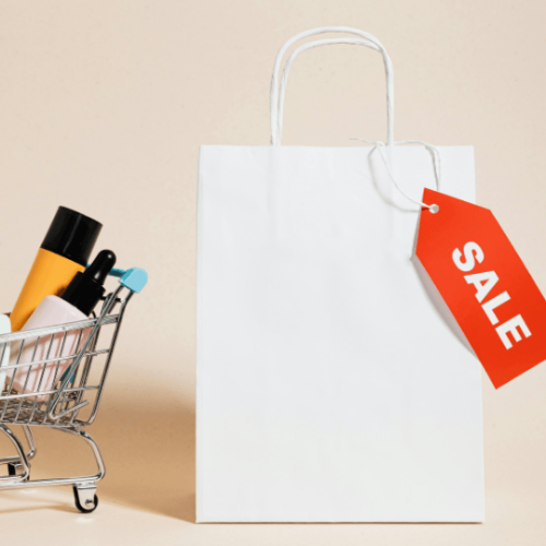 A shopping bag that has sale on it with the help of a digital marketing and advertising agency.