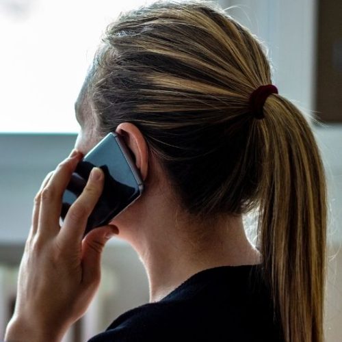 A woman talking on the phone.