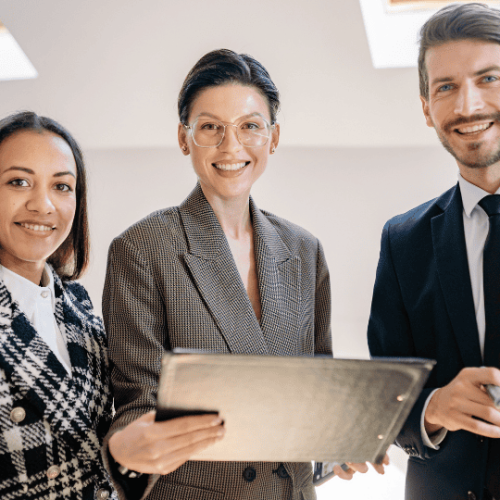 A team of business owners smiling and talking.
