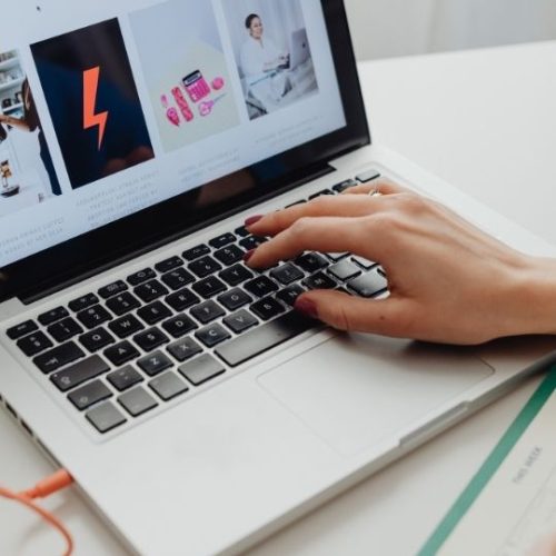 A digital marketing and advertising agency worker on her laptop.